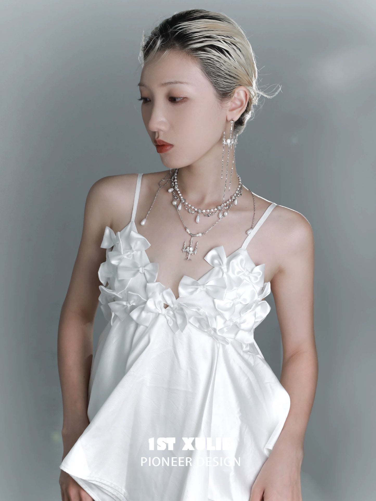 Gothic rose tassel earrings showcased on a model wearing a stylish white top