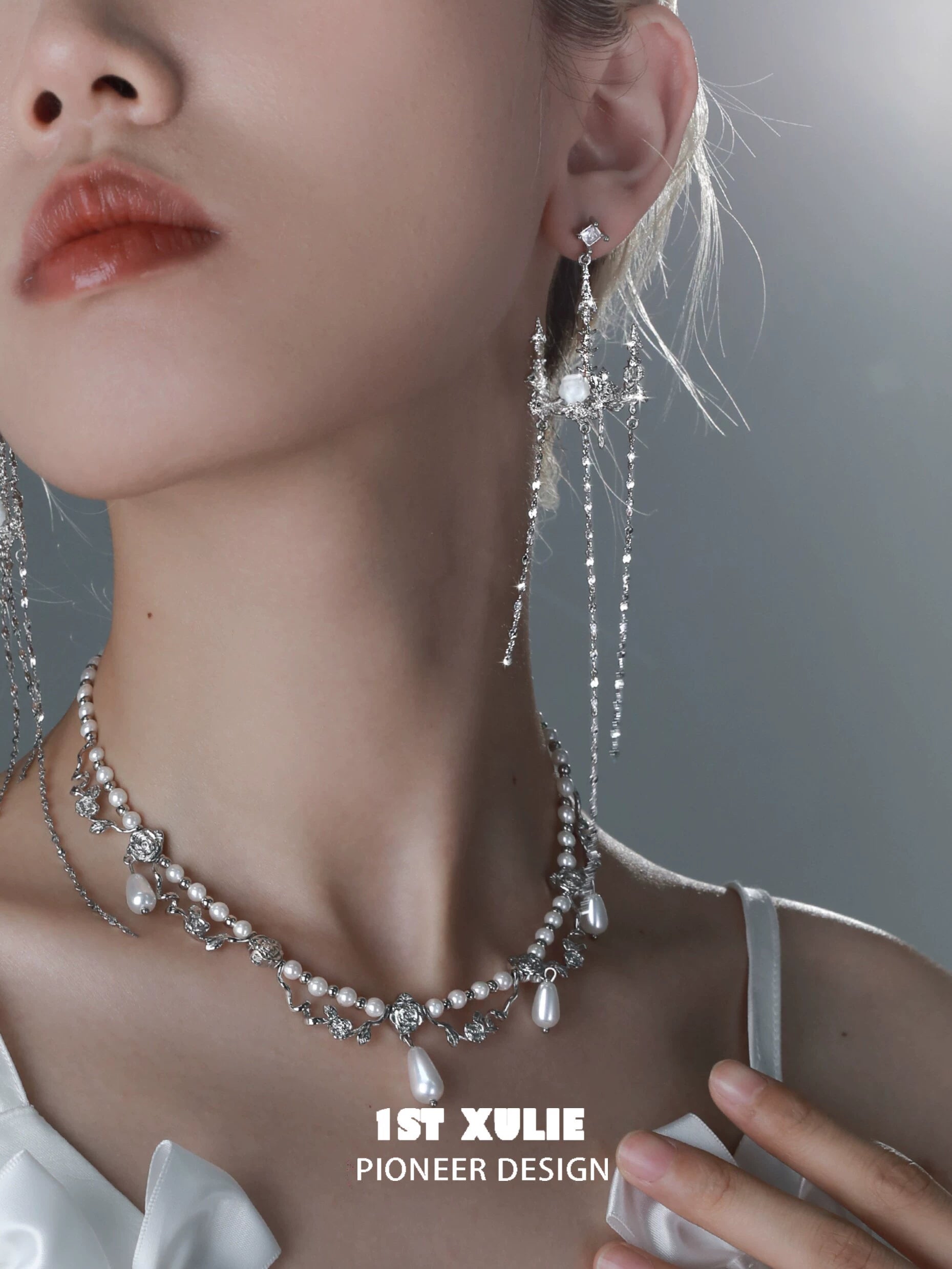Elegant gothic rose tassel earrings in silver with sparkling gemstones for a dramatic look