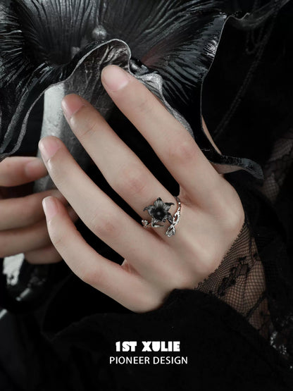 Elegant gothic silver mandala ring worn on hand with intricate design and gemstone detail