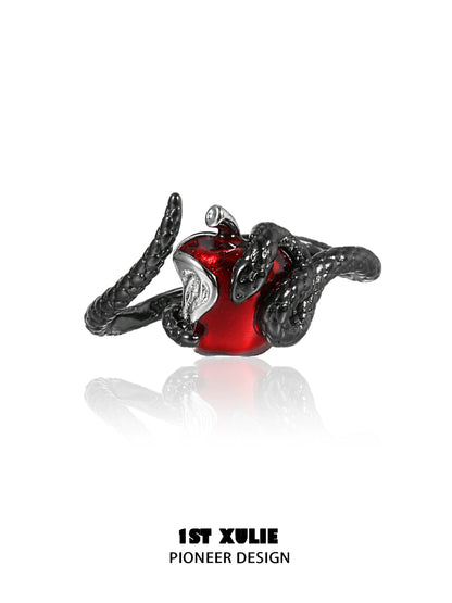 Gothic snake apple ring featuring intricate black snake design and a glossy red apple centerpiece