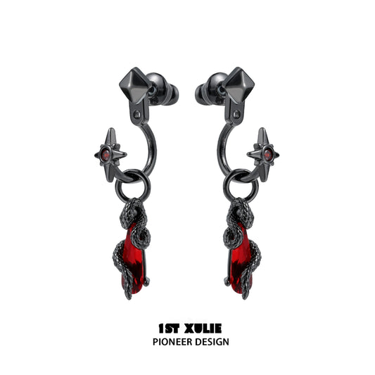 Gothic snake earrings designed by 1STXULIE featuring red accents and star details.