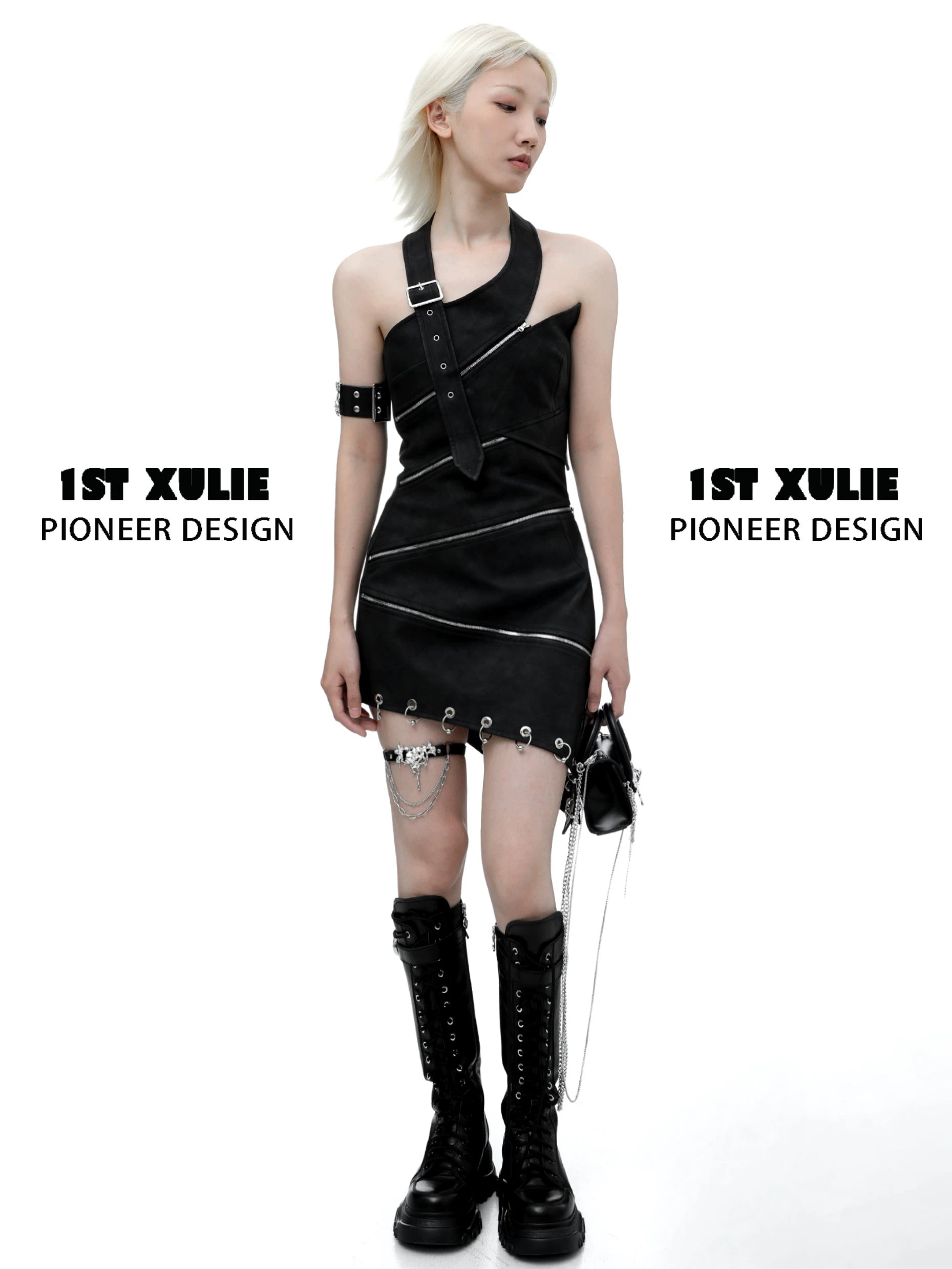 Model wearing black dress with gothic thigh chain jewelry and combat boots for a bold fashion look