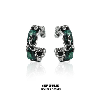Gothic venomous spirit earrings featuring intricate design with silver tones and green accents for a bold look