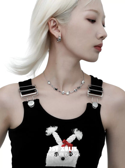 Model wearing happy puppy stud earrings paired with a stylish outfit and elegant necklace