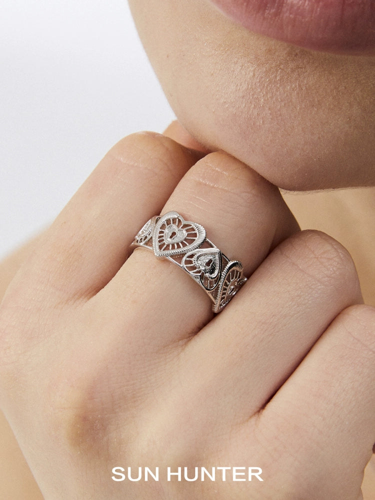 Sun Hunter heart lock ring in silver with intricate heart designs for elegant jewelry lovers