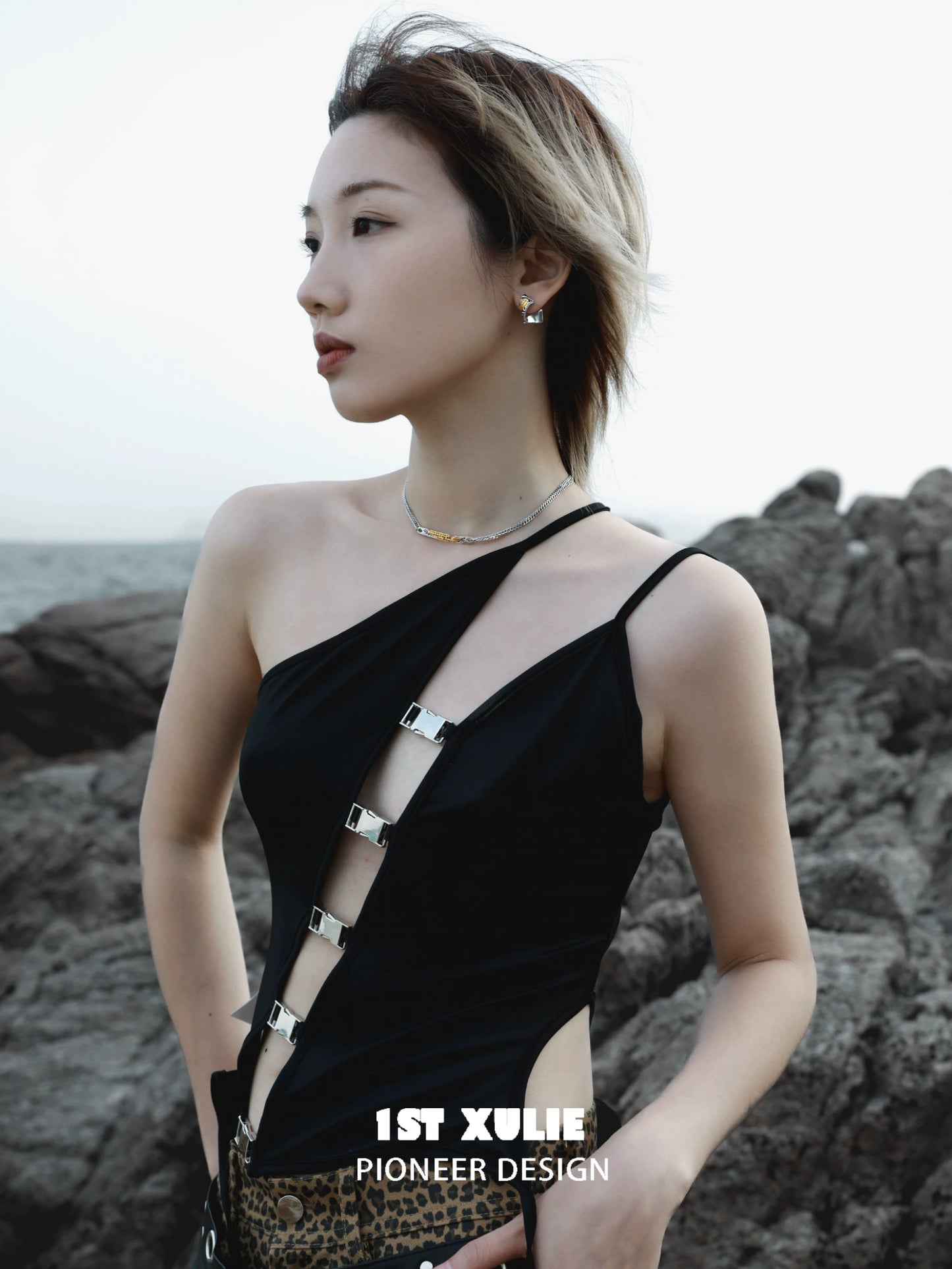 Stylish Immortal Bond Couple Necklace showcased with a model by the seaside, featuring a unique design