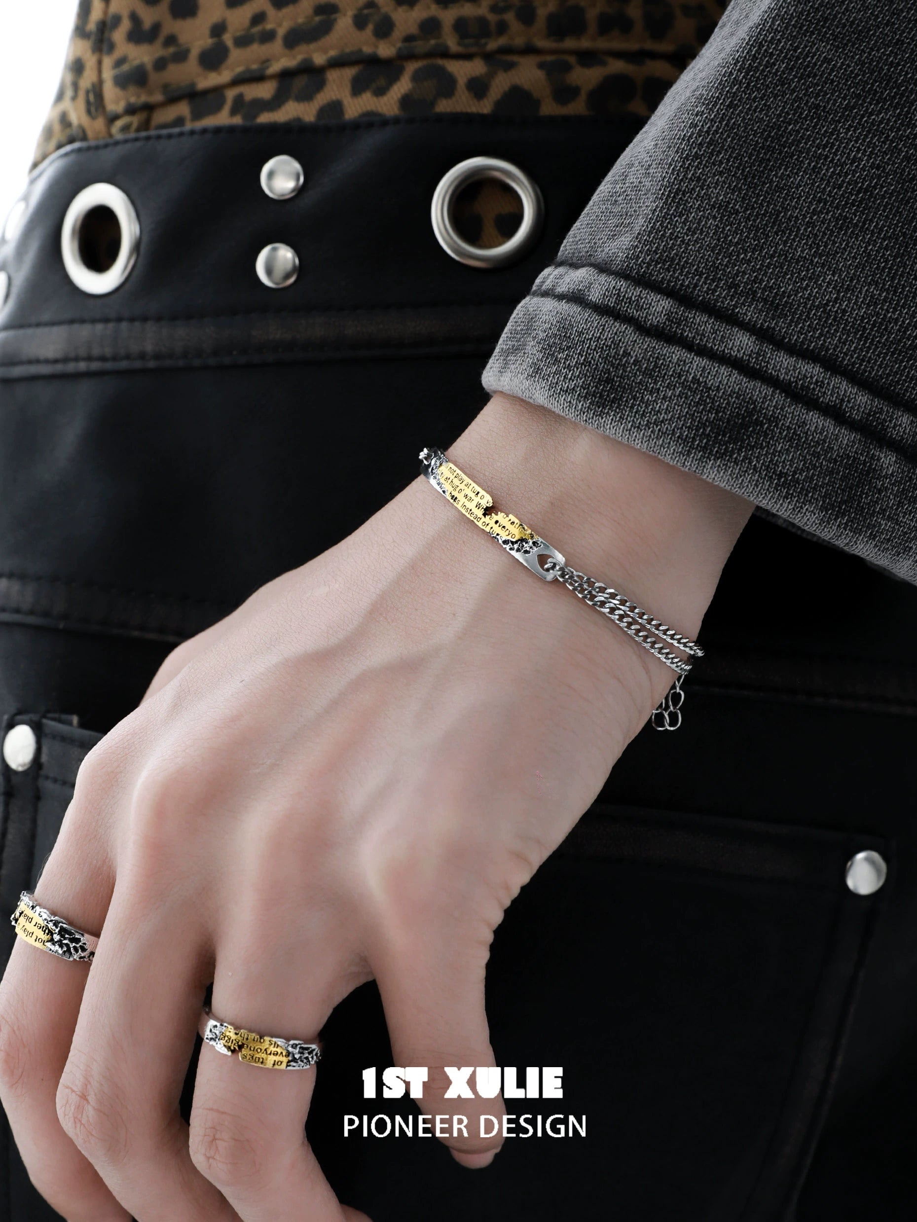 Stylish 1ST XULIE Immortal Love Letter Couple Bracelet displayed on a model's wrist with rings