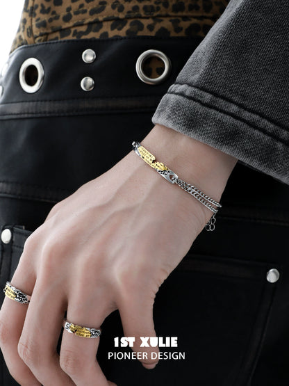 Stylish 1ST XULIE Immortal Love Letter Couple Bracelet displayed on a model's wrist with rings