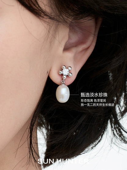Elegant island flower pearl earrings with a sparkling floral design and lustrous pearl drop