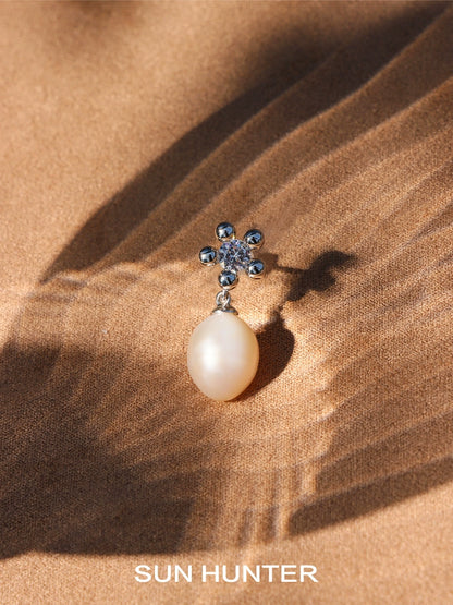 Elegant island flower pearl earrings featuring a floral design with a shimmering pearl drop