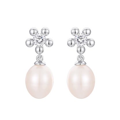 Elegant SUN HUNTER island flower pearl earrings with sparkling accents and lustrous pearls