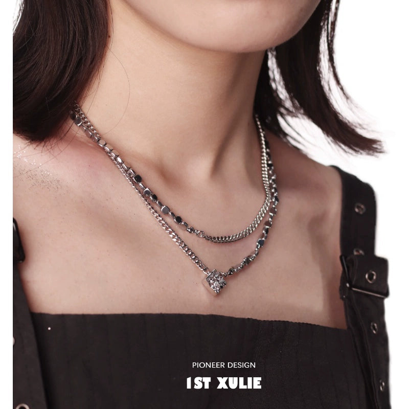 Y2K punk necklace featuring layered silver chains and a pendant for a trendy look