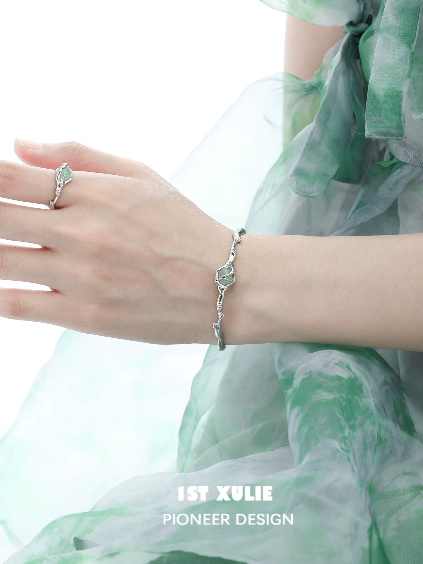 Elegant jade bamboo silver bracelet showcasing intricate design on a model's wrist