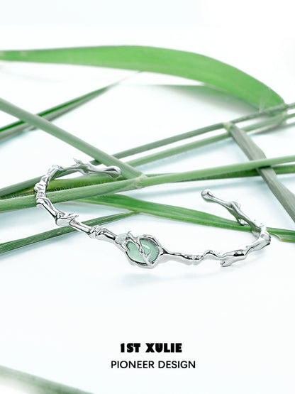 Jade bamboo silver bracelet featuring a unique design with natural jade accents