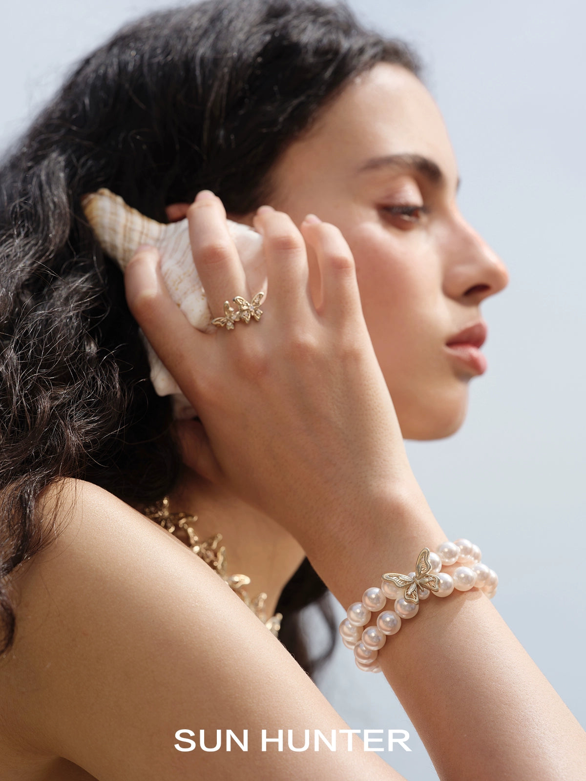 SUN HUNTER lace butterfly pearl bracelet with elegant design and shimmering pearls