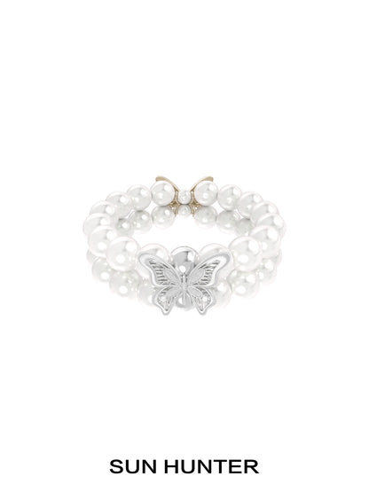 SUN HUNTER lace butterfly pearl bracelet featuring elegant pearls and a beautiful butterfly charm