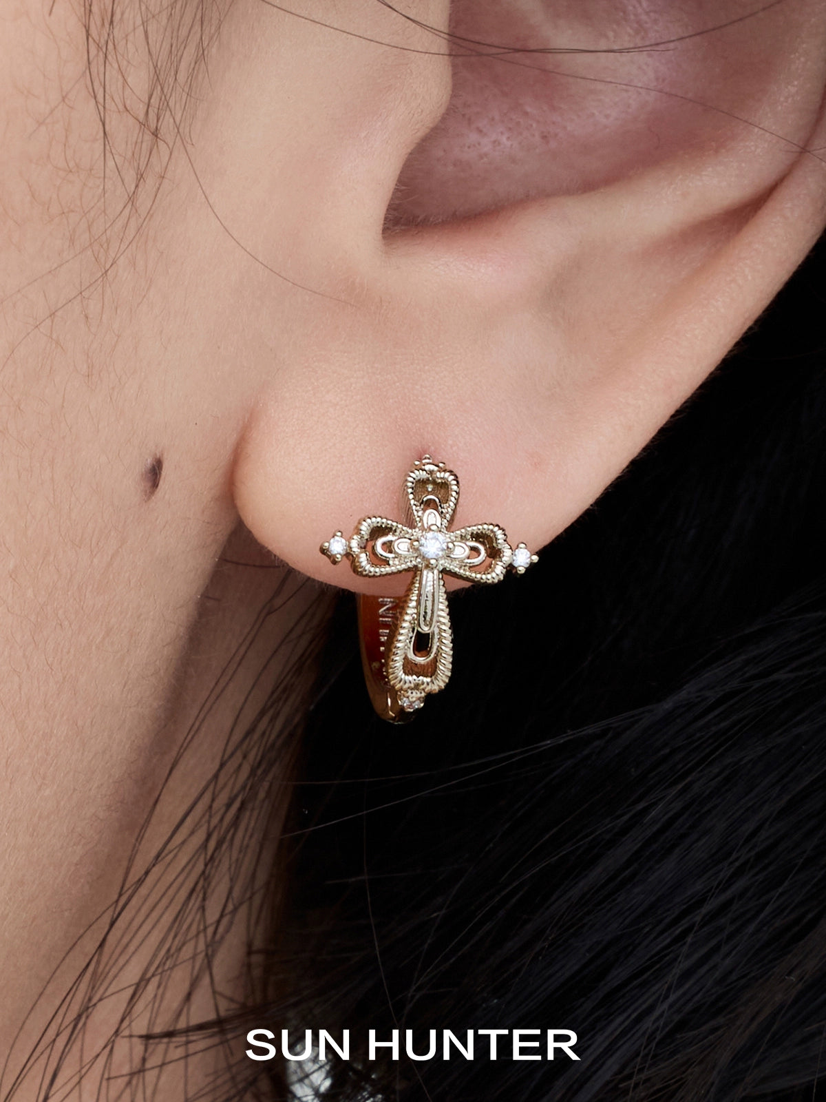 Unique SUN HUNTER lace cross earrings featuring intricate design and elegant details