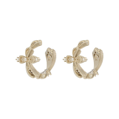 Elegant SUN HUNTER lace cross earrings in gold featuring intricate detailing for a chic look