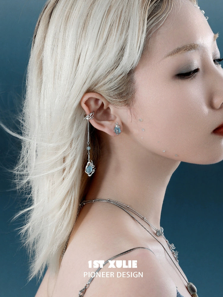 Lake elf ear cuffs in silver, worn elegantly with dangling earrings for a whimsical look