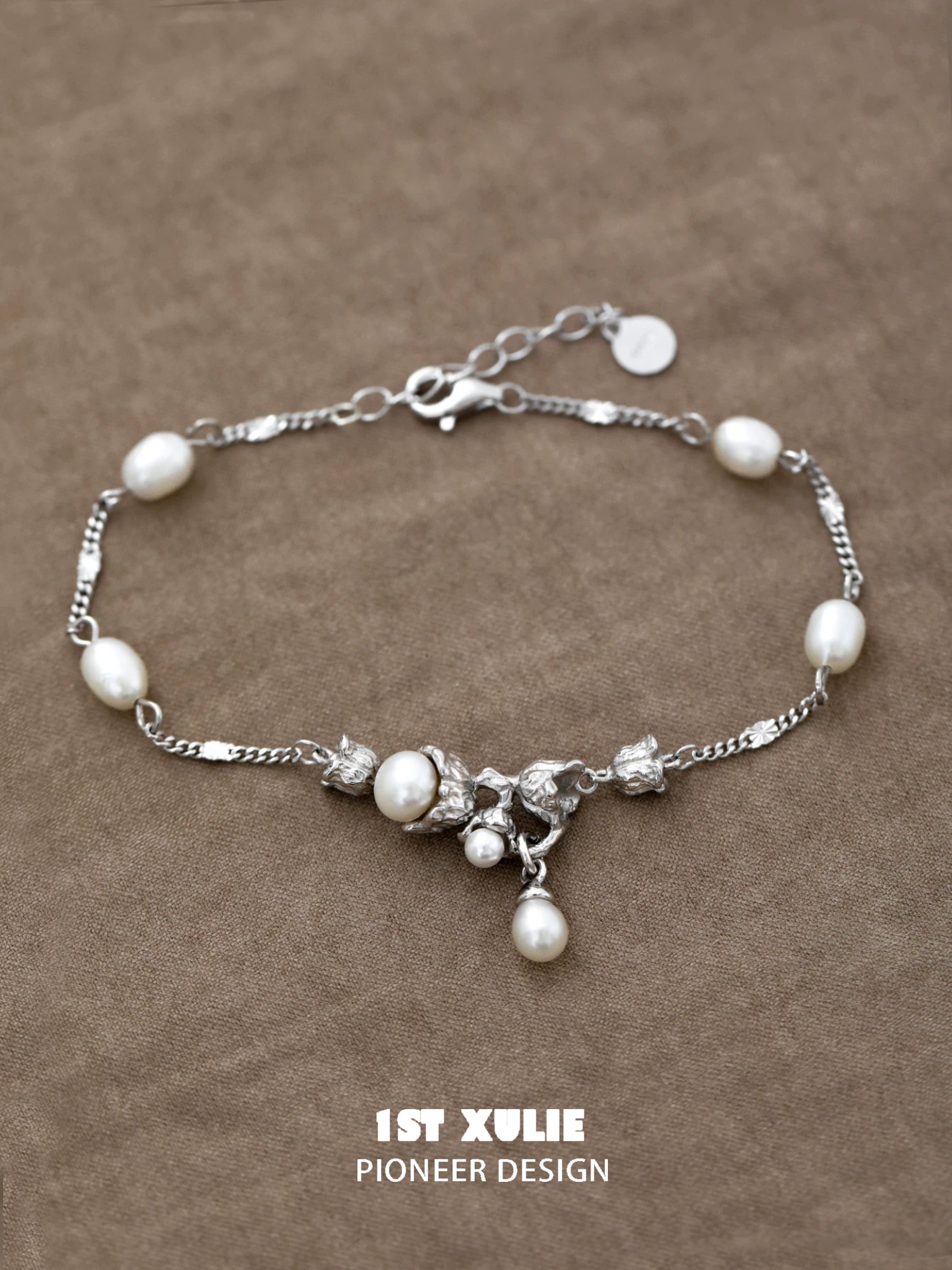 Elegant lily of the valley pearl bracelet featuring silver accents and a delicate design