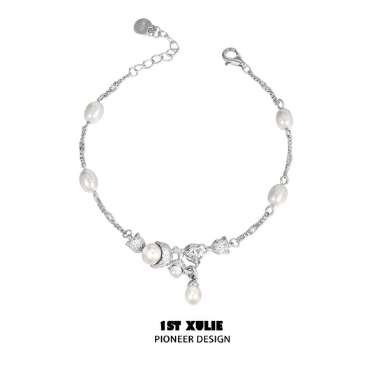 Elegant lily of the valley pearl bracelet featuring silver accents and unique floral design