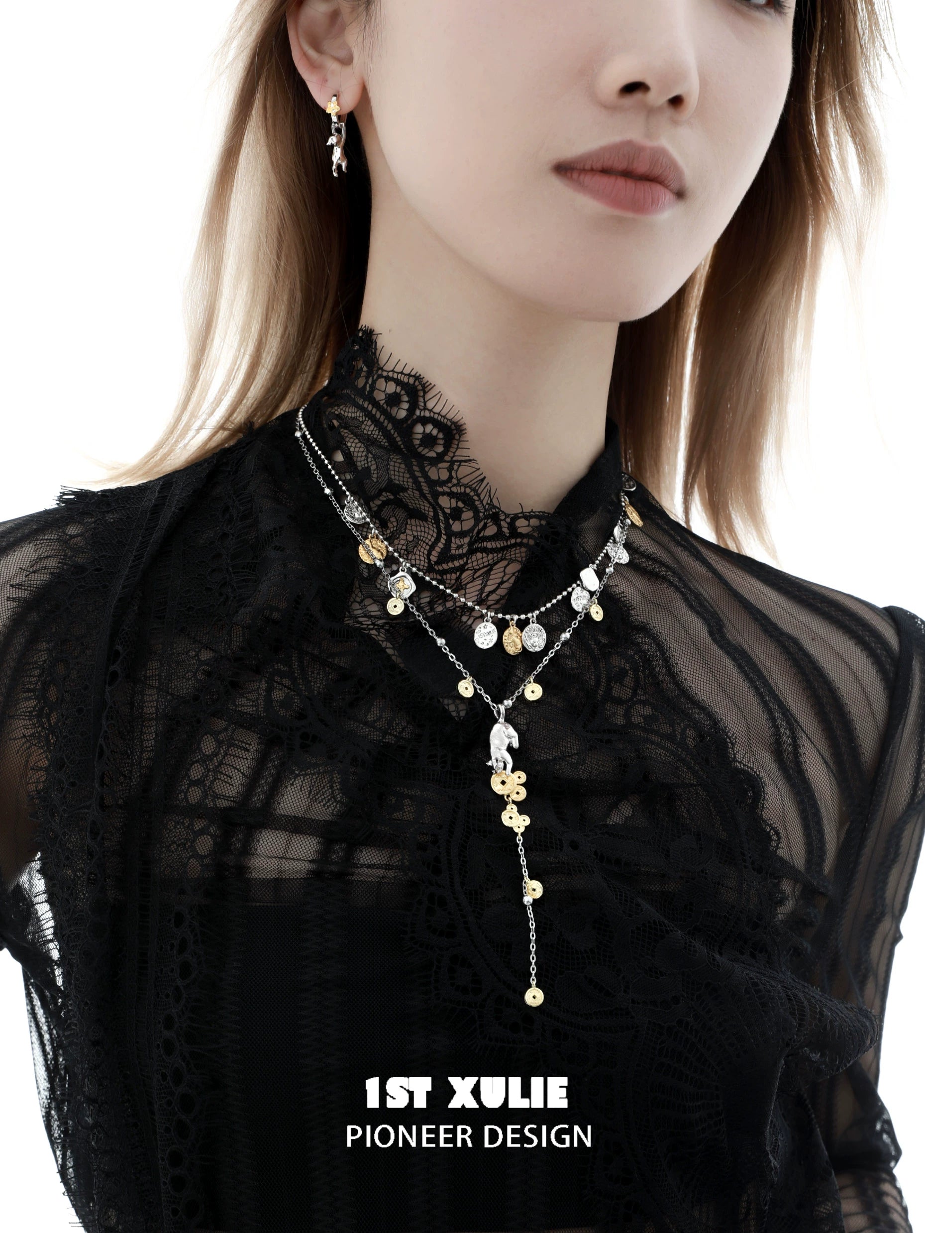 Stylish lucky cat charm necklace layered with delicate silver chains for elegant outfits