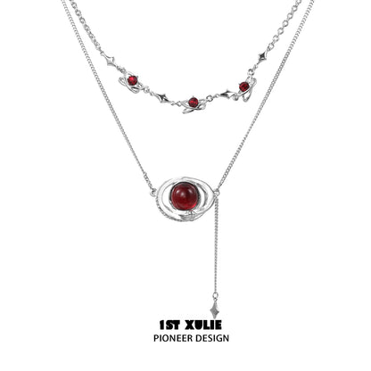 Mars inspired necklace by 1STXULIE featuring a unique design with red accents and silver chains