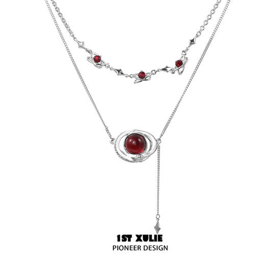 Mars inspired necklace by 1STXULIE featuring a unique design with red accents and silver chains