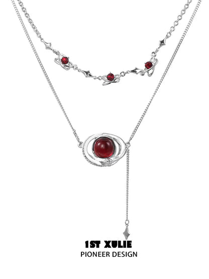 Mars inspired necklace with red gemstone and silver chain, perfect for space-themed jewelry lovers