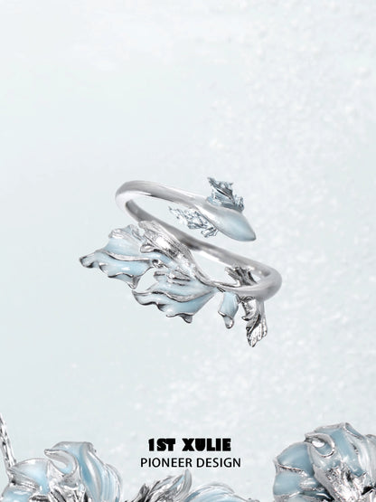 Mermaid tail silver ring featuring intricate wave designs and a polished finish