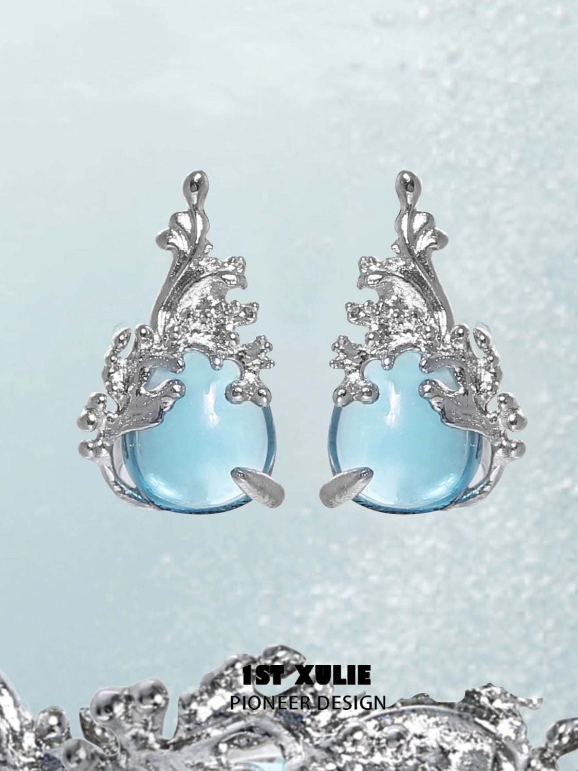 Elegant mermaid tear earrings featuring blue glass and silver leaf accents for a unique style