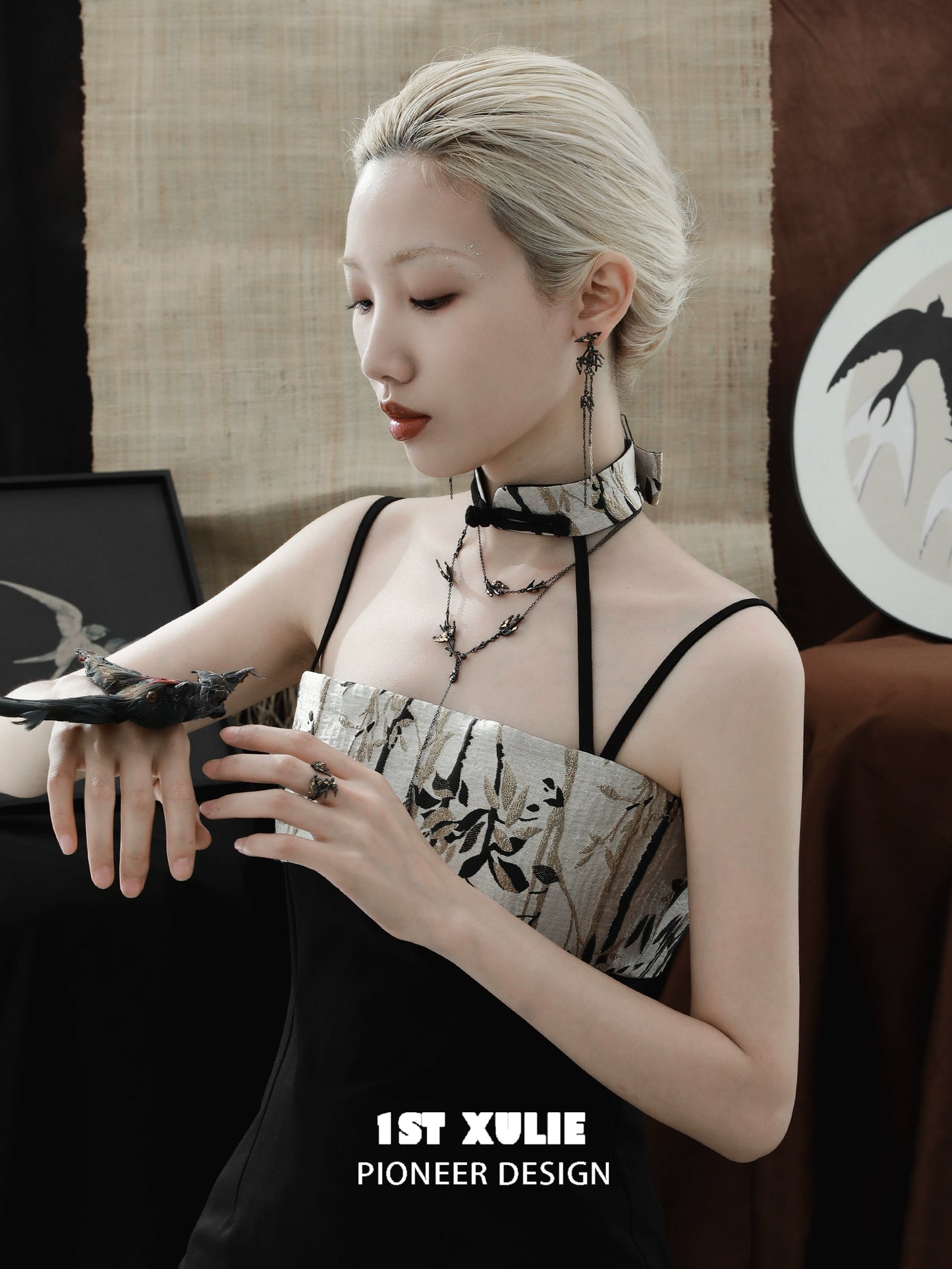 Midnight swallow gothic earrings featured with a stylish outfit and elegant accessories