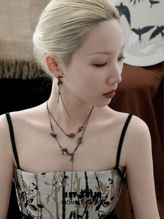 Elegant midnight swallow gothic earrings on model, showcasing intricate design and dark aesthetic