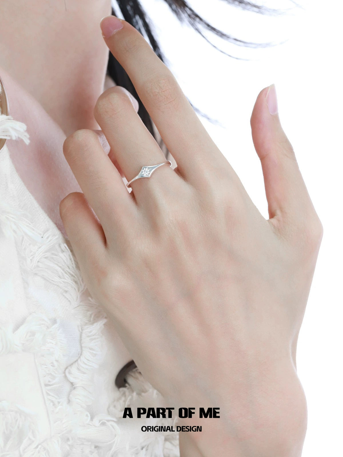 Delicate minimalist lotus silver ring showcased on a hand with a stylish outfit