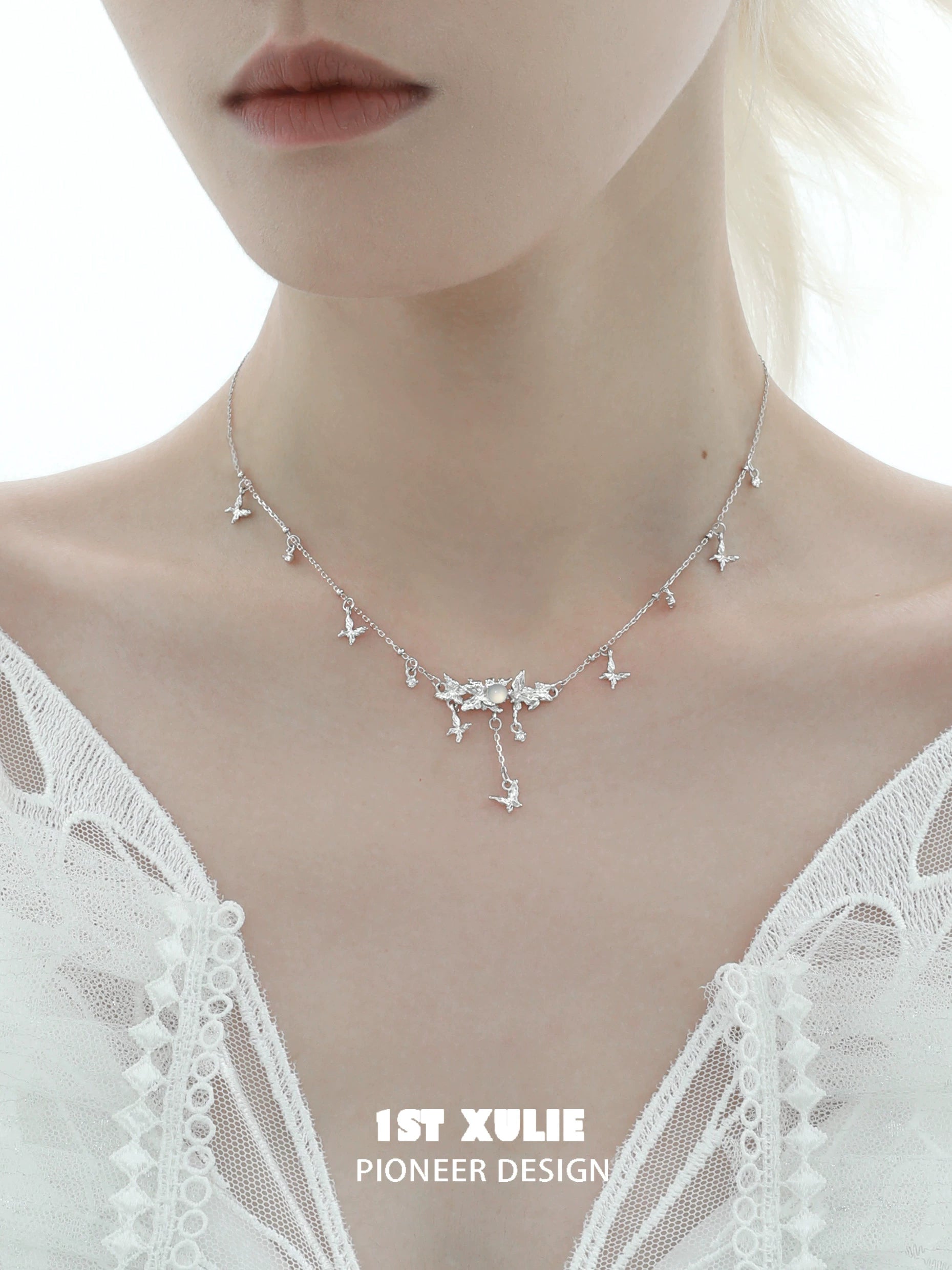 Mint butterfly necklace from 1STXULIE featuring delicate silver butterfly charms for a chic look