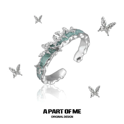 A PART OF ME Mint Butterfly Ring featuring a unique design with silver butterfly accents