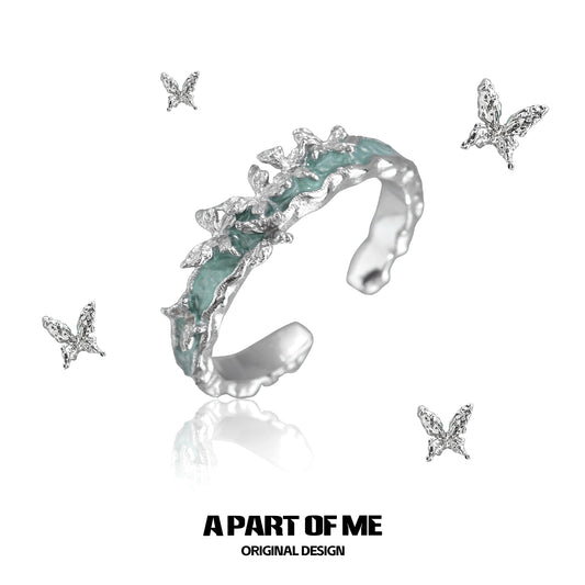 A PART OF ME Mint Butterfly Ring featuring a unique design with silver butterfly accents