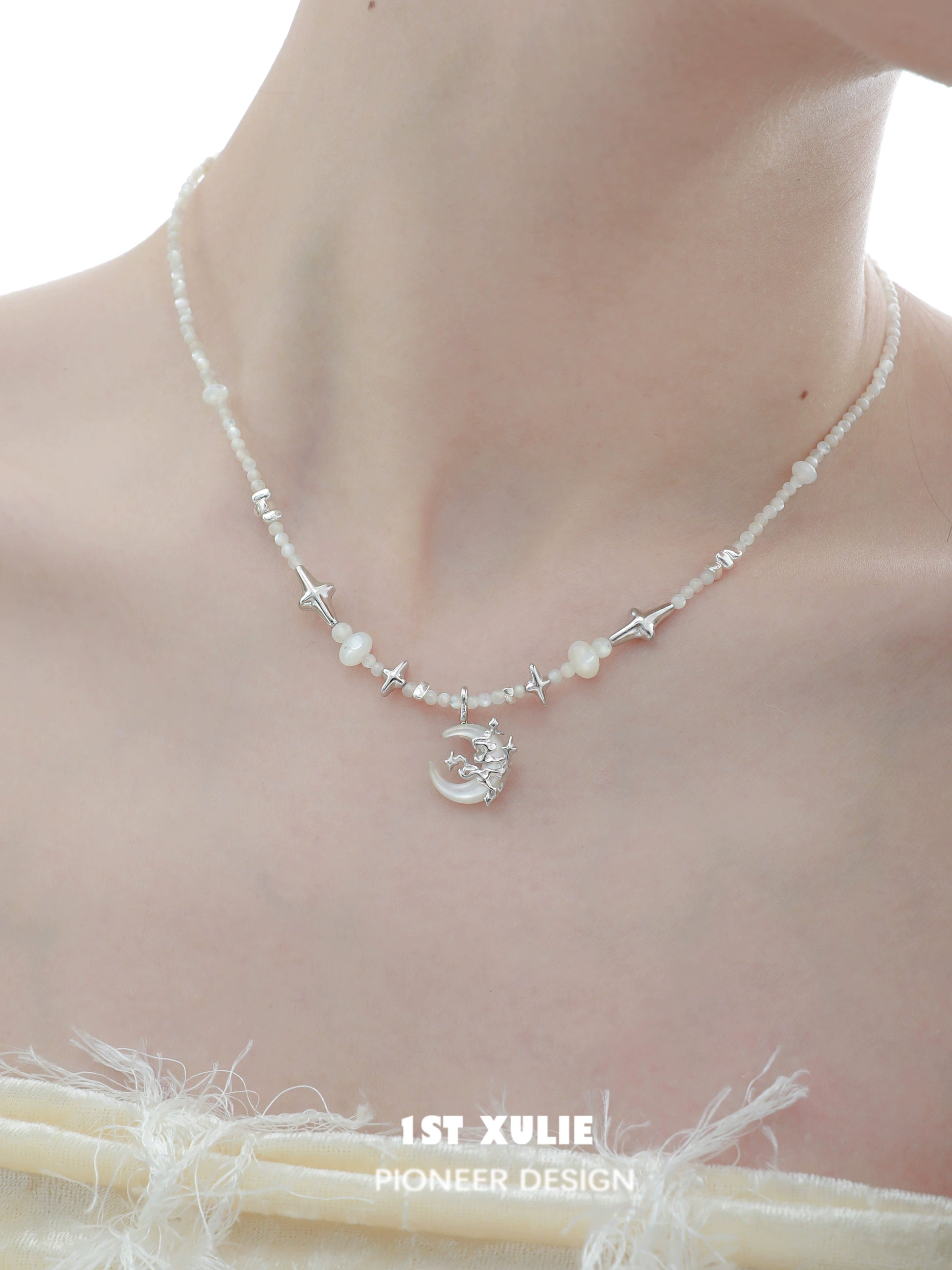 Moon beaded clavicle chain necklace featuring star and pearl accents for a celestial look