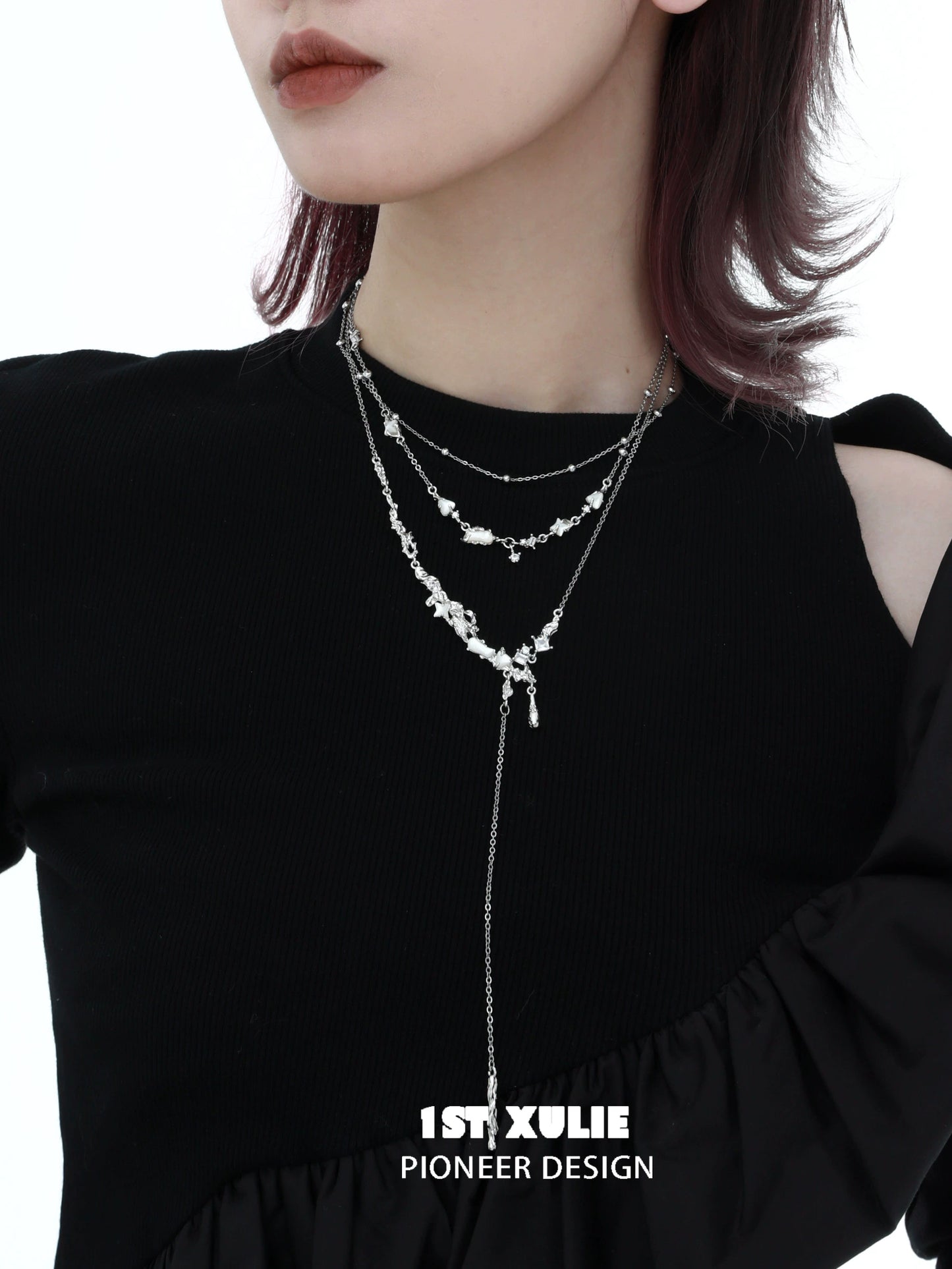 Layered moonlight fragment silver necklace with delicate floral design worn by a model