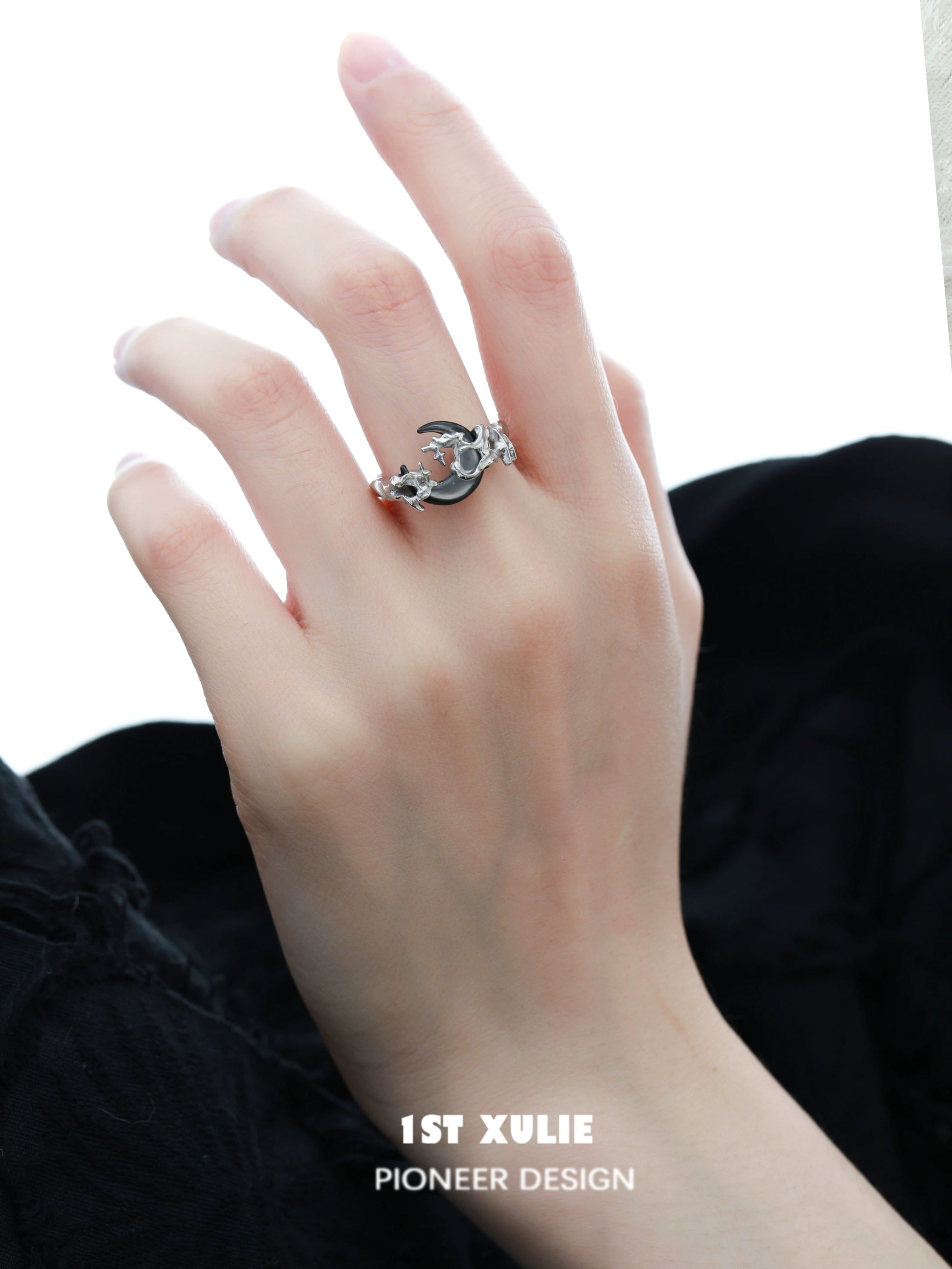 Moonlit orchid ring showcased on a hand, highlighting its unique design and elegance