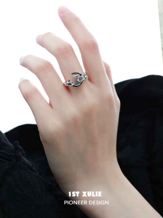Moonlit orchid ring showcased on a hand, highlighting its unique design and elegance