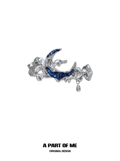 A PART OF ME Mystic Blue Moon Ring with a shimmering blue gemstone and unique silver design