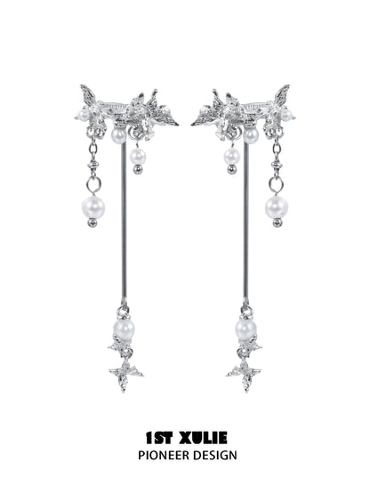 Elegant mystic butterfly ear clips with dangling pearls and intricate design from 1STXULIE