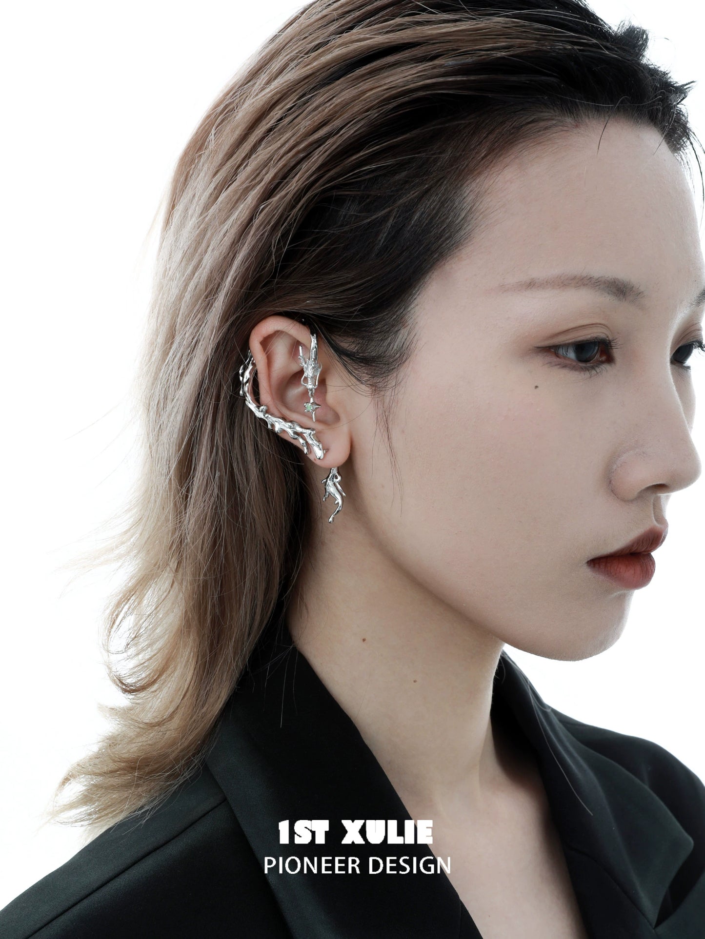 Stylish mystic dragon ear studs in silver, showcasing a unique design on a model's ear