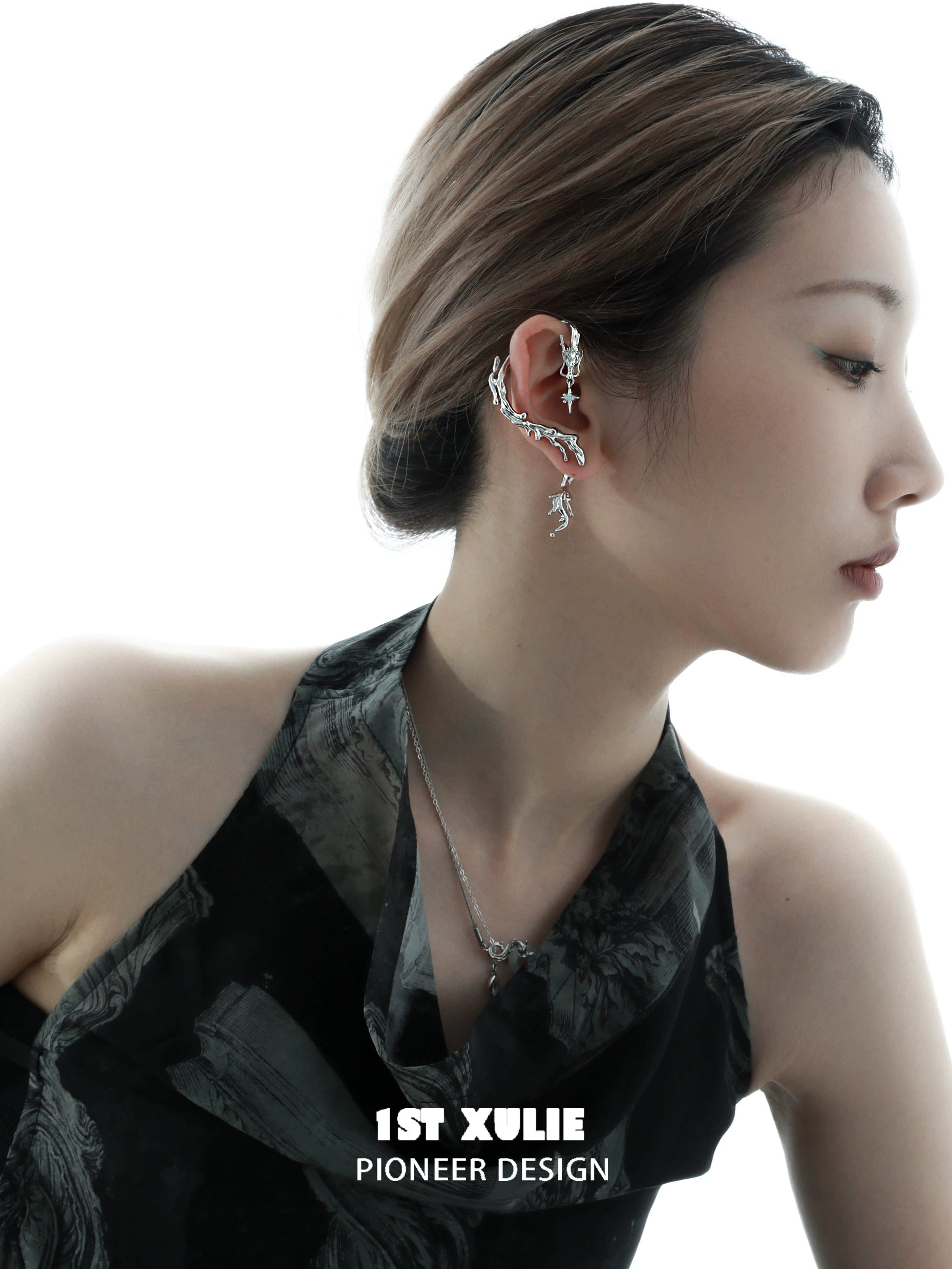 Stylish mystic dragon ear studs showcased on a model with elegant hairstyle and outfit