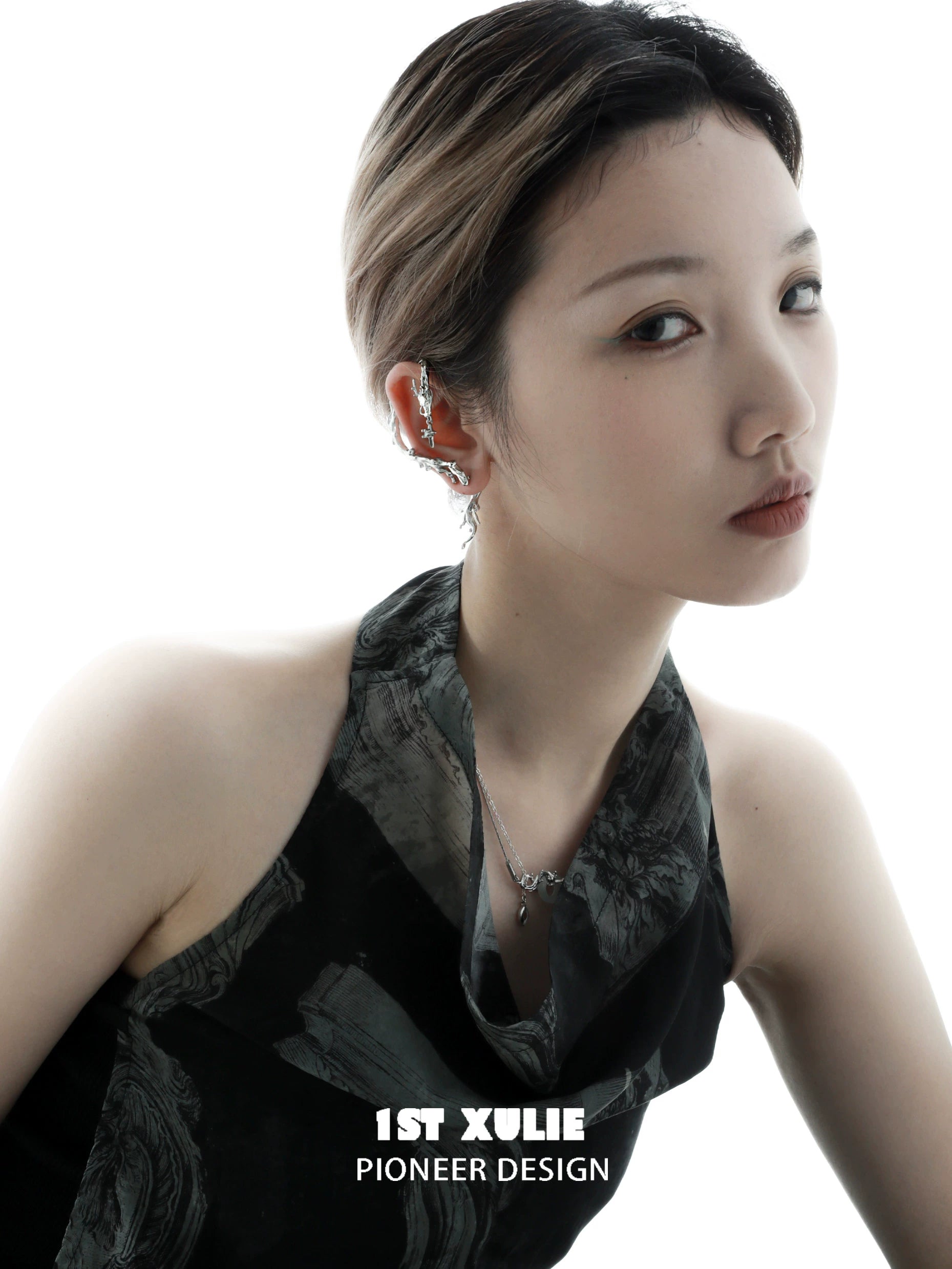 Elegant model showcasing Mystic Dragon Ear Studs with intricate design and shimmering details