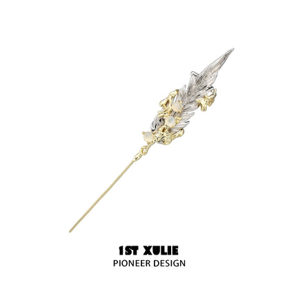 Elegant mystic feather piercing earring with intricate detailing and a gold and silver finish