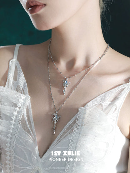 Elegant model wearing a silver mystic sprite necklace with intricate design and sparkling accents