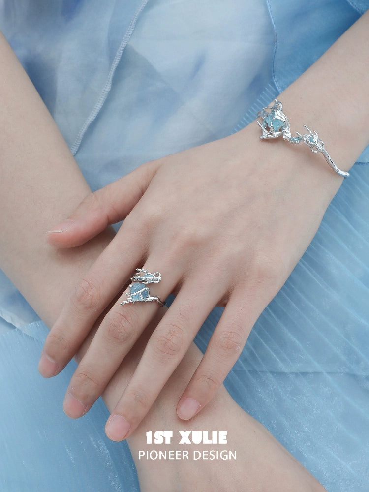 Elegant ocean dragon king sapphire bracelet showcased on a model's wrist, complemented by a matching ring