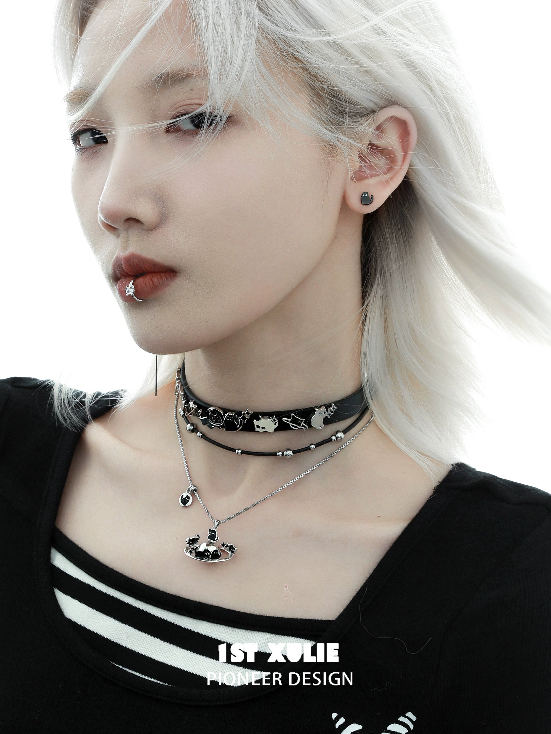 Owl leather necklace shown on a model with silver accents and layered chokers for a stylish look